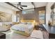 Main bedroom featuring a ceiling fan, two large windows and a relaxing sitting area at 621 Kearney St, Denver, CO 80220