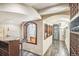 Unique wine cellar with decorative niches, stone walls, an elegant wrought iron door, and wine tasting bar at 621 Kearney St, Denver, CO 80220