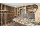 Spacious wine cellar with extensive wood racking, a decorative countertop, and a sink for tastings and preparation at 621 Kearney St, Denver, CO 80220