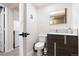 Modern basement bathroom with toilet, vanity, and shower at 4700 S Decatur St, Englewood, CO 80110