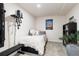 Basement bedroom with twin bed and home gym at 4700 S Decatur St, Englewood, CO 80110