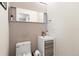 Modern powder room with updated vanity and textured wall at 4700 S Decatur St, Englewood, CO 80110