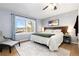 Bright bedroom with a queen-size bed and large window at 4700 S Decatur St, Englewood, CO 80110