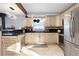 Modern kitchen featuring light-colored cabinets and granite countertops at 4700 S Decatur St, Englewood, CO 80110