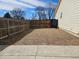 Spacious backyard with gravel landscaping, enclosed by a wooden fence for privacy and security at 808 Idalia St, Aurora, CO 80011