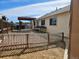 Backyard with gravel landscaping, a charming gazebo, and ample space for outdoor activities at 808 Idalia St, Aurora, CO 80011