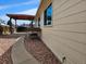A home's exterior featuring a quaint patio, perfect for relaxing and unwinding in style at 808 Idalia St, Aurora, CO 80011