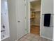Bathroom featuring tile floors, bathtub, and closet with shelves at 808 Idalia St, Aurora, CO 80011