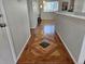 Inviting entryway with decorative wood flooring and clear sightlines to the living area, showcasing the home's open layout at 808 Idalia St, Aurora, CO 80011