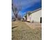 Beige house with stone landscaping and a fenced in backyard at 808 Idalia St, Aurora, CO 80011
