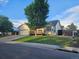 Charming single-Gathering home with a well-manicured lawn, mature trees, and a two-car garage at 808 Idalia St, Aurora, CO 80011