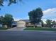Charming single-Gathering home with a well-manicured lawn, mature trees, and a two-car garage at 808 Idalia St, Aurora, CO 80011
