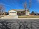 Charming single-Gathering home with a well-manicured lawn, mature trees, and a two-car garage at 808 Idalia St, Aurora, CO 80011