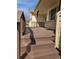 Covered front porch with wooden deck and wooden support beams at 808 Idalia St, Aurora, CO 80011