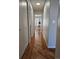 Hallway featuring wood flooring and white trim at 808 Idalia St, Aurora, CO 80011