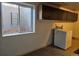 Laundry room with a washer and overhead cabinets at 808 Idalia St, Aurora, CO 80011