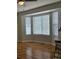 Bright living area featuring large bay windows, hardwood floors, and an open space, creating an airy atmosphere at 808 Idalia St, Aurora, CO 80011