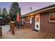 Cozy back deck featuring a table with chairs, perfect for outdoor dining and relaxation at 11398 W Ford Pl, Lakewood, CO 80226