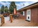 Back deck features a table and chairs, ideal for enjoying outdoor meals at 11398 W Ford Pl, Lakewood, CO 80226