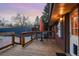 Wooden back deck furnished with a table and chairs for outdoor relaxation at 11398 W Ford Pl, Lakewood, CO 80226
