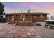 Backyard features a deck, stone patio, and a spot for outdoor games at 11398 W Ford Pl, Lakewood, CO 80226