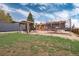 Large backyard featuring a pergola, trampoline, deck, and ample green space at 11398 W Ford Pl, Lakewood, CO 80226