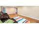 Finished basement space showcasing a brown sofa and open layout at 11398 W Ford Pl, Lakewood, CO 80226