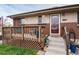 Close-up of the front porch, with seating and decor adding a welcoming feel to the entry at 11398 W Ford Pl, Lakewood, CO 80226