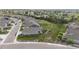Aerial showing landscaped neighborhood with mountain views and walking paths at 15604 Xenia Way, Brighton, CO 80602