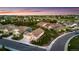 Stunning aerial view of a neighborhood showcasing well-maintained homes and lush green landscapes at 15604 Xenia Way, Brighton, CO 80602
