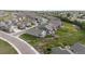 Neighborhood aerial showing many homes with nice landscaping and mountain views at 15604 Xenia Way, Brighton, CO 80602