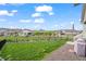 Grassy backyard featuring a well-kept lawn and neighborhood views at 15604 Xenia Way, Brighton, CO 80602
