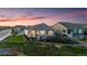 A backyard showcasing a well-maintained lawn, lush landscaping, and charming garden beds at 15604 Xenia Way, Brighton, CO 80602