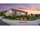 Beautifully landscaped yard with a charming home featuring stone accents and well-manicured lawn at 15604 Xenia Way, Brighton, CO 80602