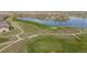 Scenic view of the golf course winding through the community, offering a serene and picturesque landscape at 15604 Xenia Way, Brighton, CO 80602