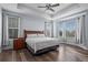Spacious main bedroom features tray ceiling, bay window, wood floors, and lots of natural light at 15604 Xenia Way, Brighton, CO 80602