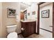 Small bathroom with a toilet and a pedestal sink at 680 S Main St # 19, Breckenridge, CO 80424