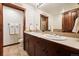 Double vanity bathroom with a large mirror and additional toilet area at 680 S Main St # 19, Breckenridge, CO 80424