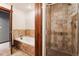 Clean bathroom with a shower, bathtub, and tile surround at 680 S Main St # 19, Breckenridge, CO 80424