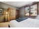 Bright bedroom with a queen-size bed and built-in wooden wardrobe at 680 S Main St # 19, Breckenridge, CO 80424
