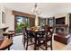 Bright dining area features a wood table and chairs, and access to a patio at 680 S Main St # 19, Breckenridge, CO 80424