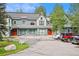 Front view of townhomes with attached garages and parking at 680 S Main St # 19, Breckenridge, CO 80424