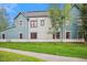 Rear view of townhome showing siding and landscaping at 680 S Main St # 19, Breckenridge, CO 80424