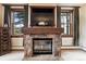 Stone fireplace with built-in media niche and wood mantel at 680 S Main St # 19, Breckenridge, CO 80424
