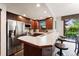 Modern kitchen with stainless steel appliances and breakfast bar at 680 S Main St # 19, Breckenridge, CO 80424