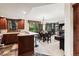 Open kitchen with dark wood cabinets, stainless steel appliances, and breakfast bar at 680 S Main St # 19, Breckenridge, CO 80424