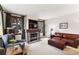 Living room with fireplace, comfy seating and large windows at 680 S Main St # 19, Breckenridge, CO 80424