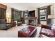 Cozy living room with a stone fireplace, comfortable seating, and large windows at 680 S Main St # 19, Breckenridge, CO 80424