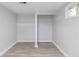 Empty bedroom featuring closet and light wood flooring at 5463 Shoshone St, Denver, CO 80221