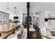 Hallway leading from the kitchen, showcasing modern finishes and natural light throughout the home at 5463 Shoshone St, Denver, CO 80221